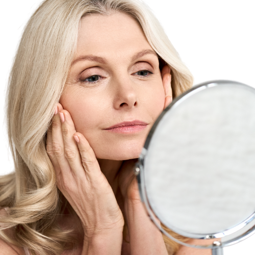 Woman looking in mirror.