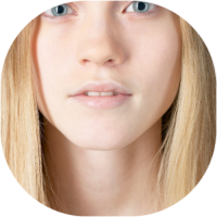 Image of girl with blonde hair, blue eyes and pale skin.